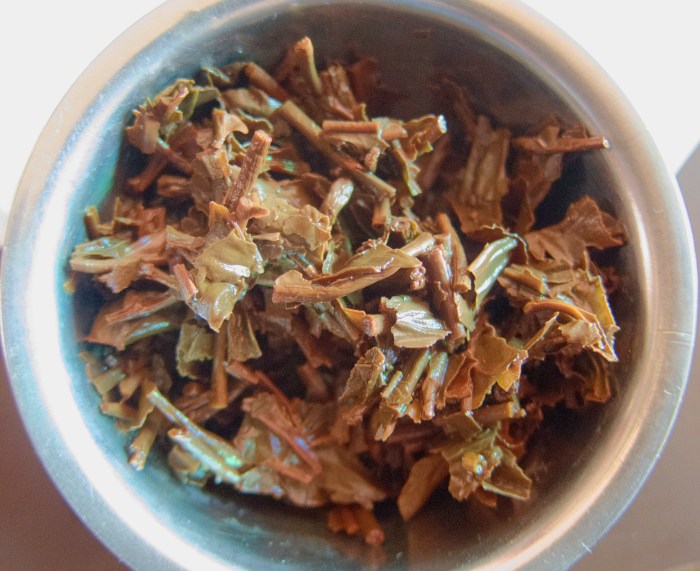 Tea leaves after steeping. Note that this tea is "broken leaf," not whole leaf.